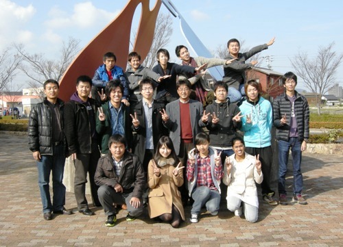 With Lab Members in front of university