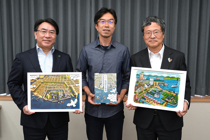 西成典久教授の受賞報告式ならびにイラスト贈呈式を開催しました